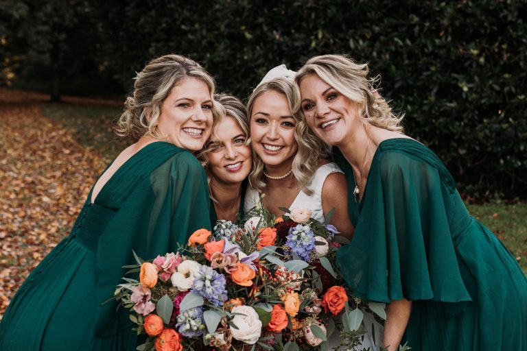 three bridesmaids with bride