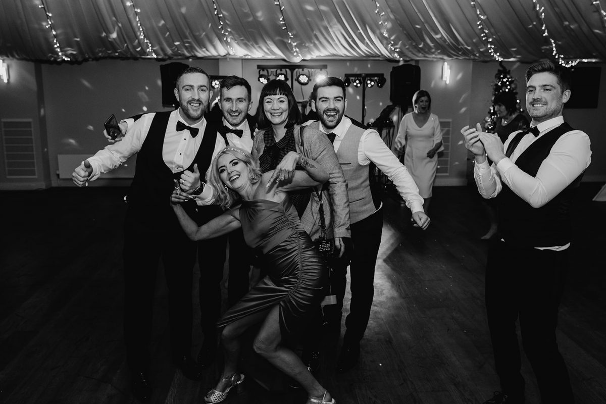 wedding dance floor photo showing guests with the photographer, Victoria Whiting